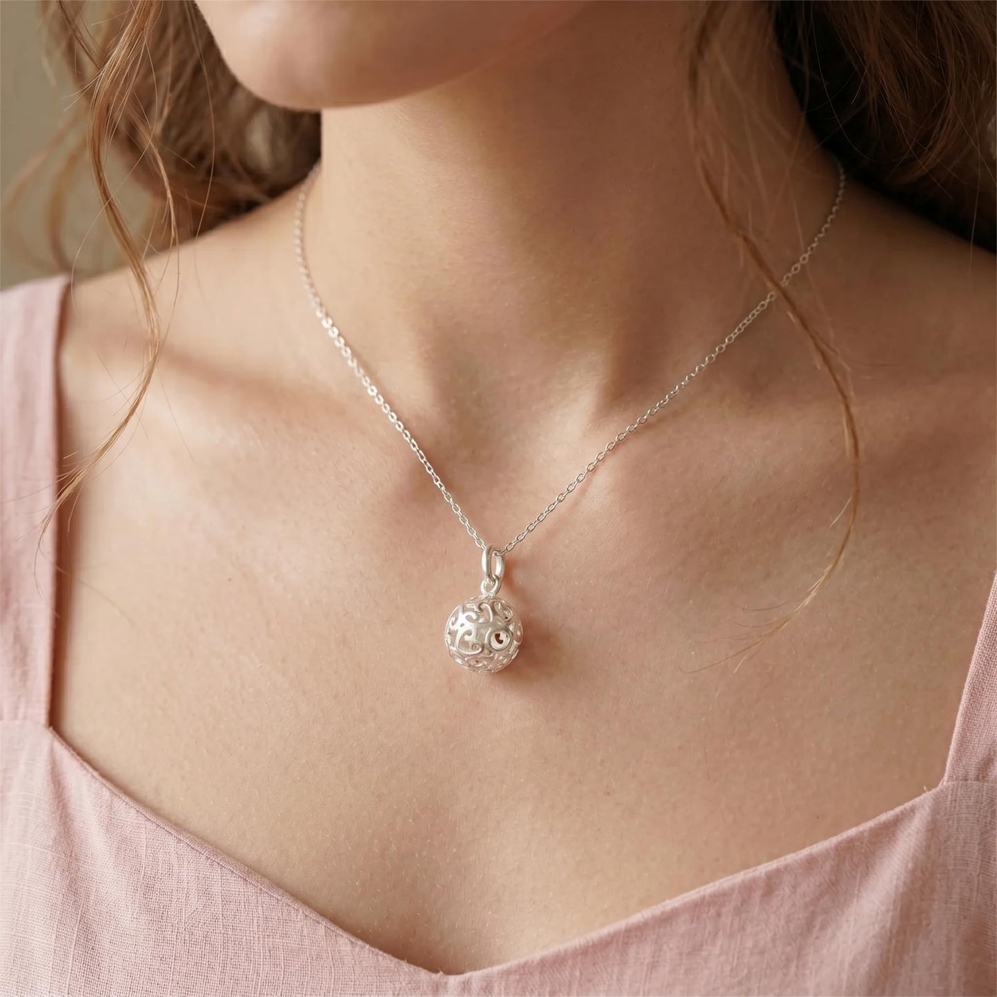 Silver filigree heart pendant on necklace chain, 3D swirl cutouts