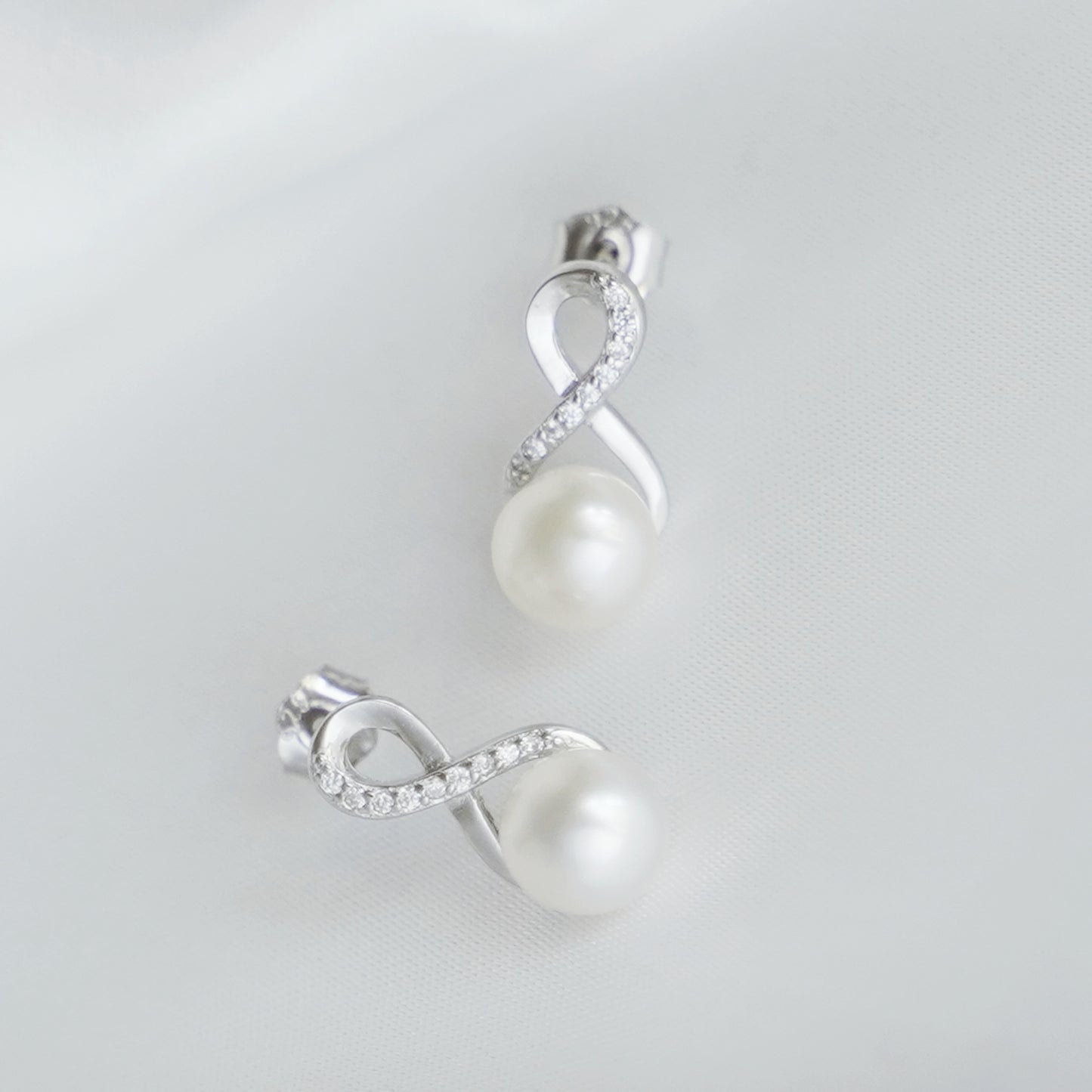 Sterling Silver Infinity Knot Natural Freshwater Pearl Stud Earrings - sugarkittenlondon