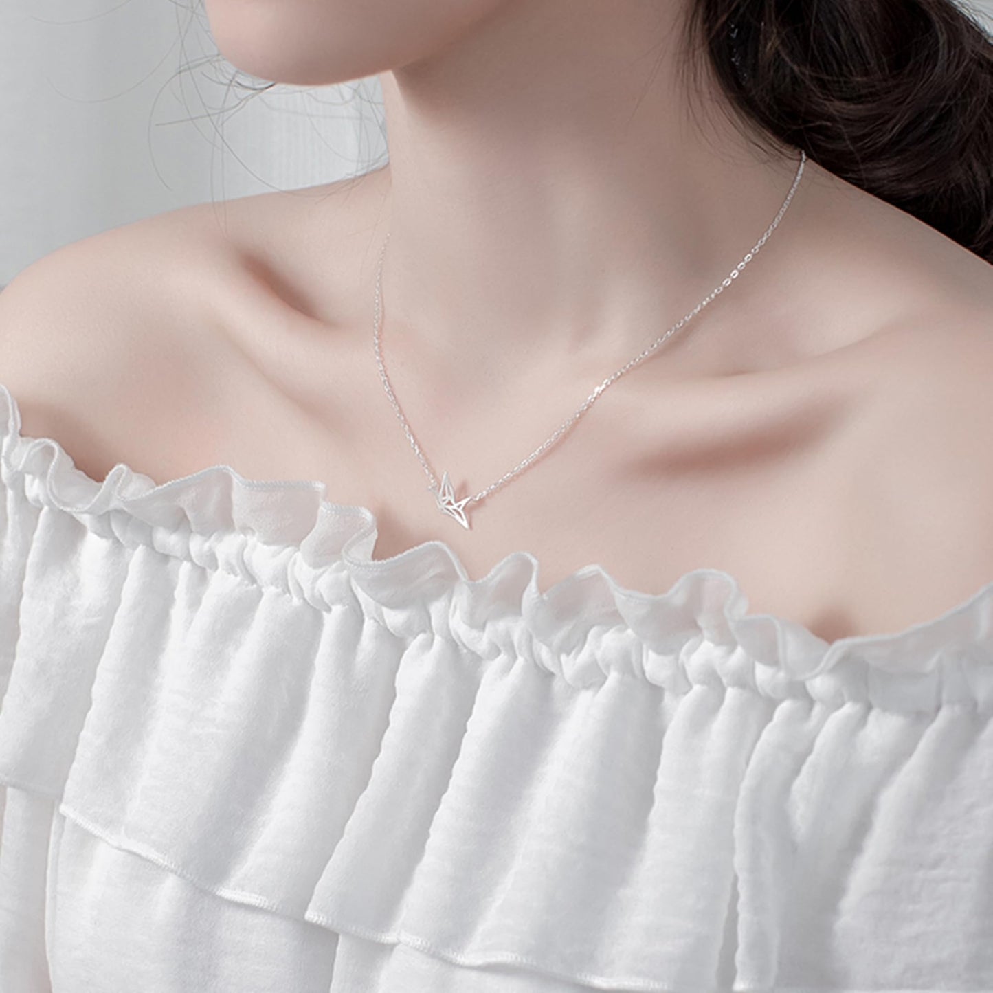 Origami crane necklace with small crane pendant on silver-tone chain