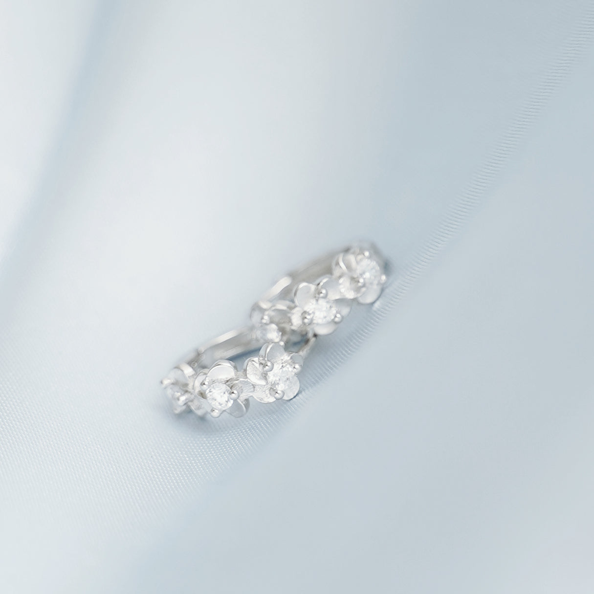 Rhodium on Sterling Silver Triple Camellia Blossom CZ Huggie Hoop Earrings - sugarkittenlondon