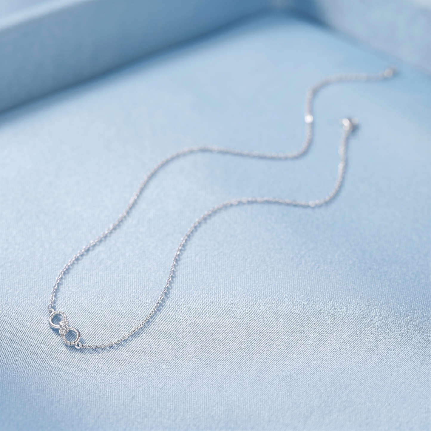 Silver chain necklace with small infinity charm and connector loops