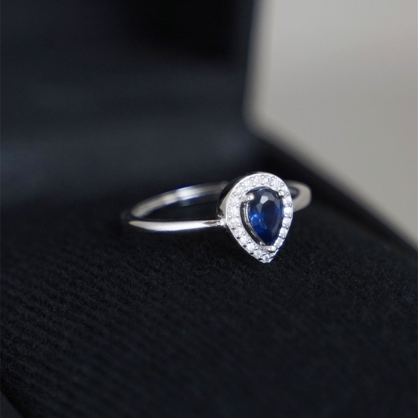 Rhodium on Sterling Silver Teardrop Cut Blue Sapphire Paved CZ Halo Sizable Ring - sugarkittenlondon