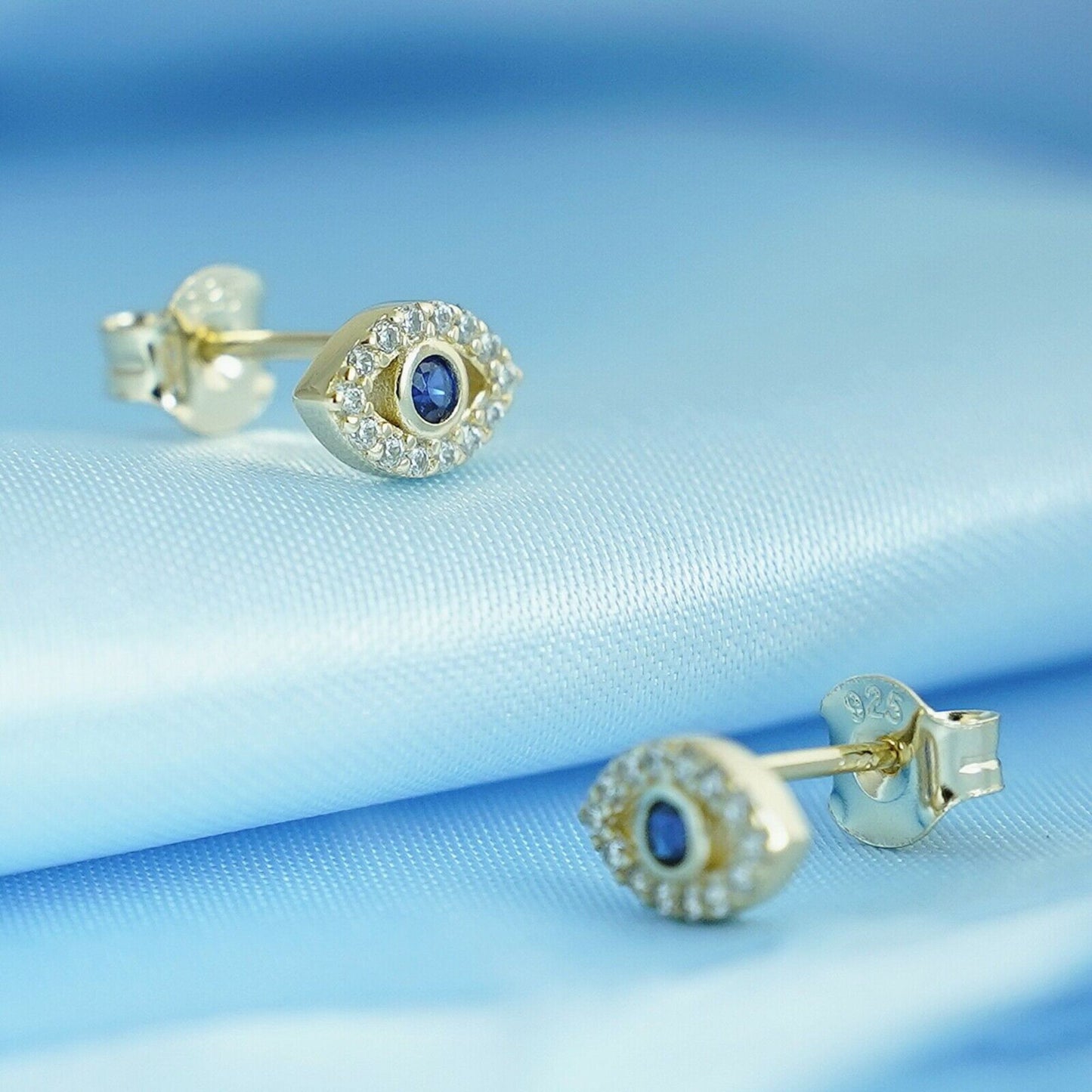 Sterling Silver Evil Eye Stud Earrings with 14K Gold Plating and Blue and White CZ