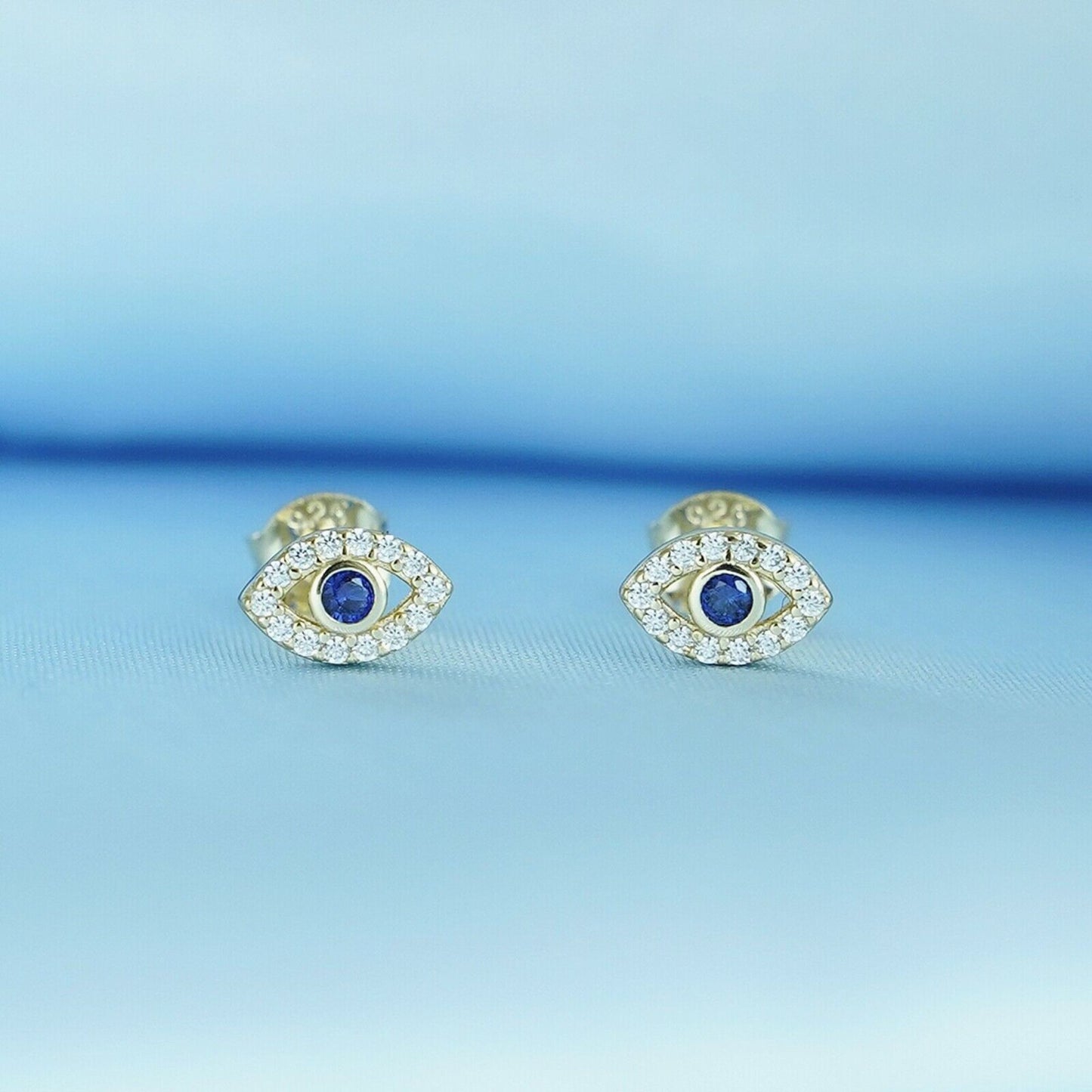 Sterling Silver Evil Eye Stud Earrings with 14K Gold Plating and Blue and White CZ