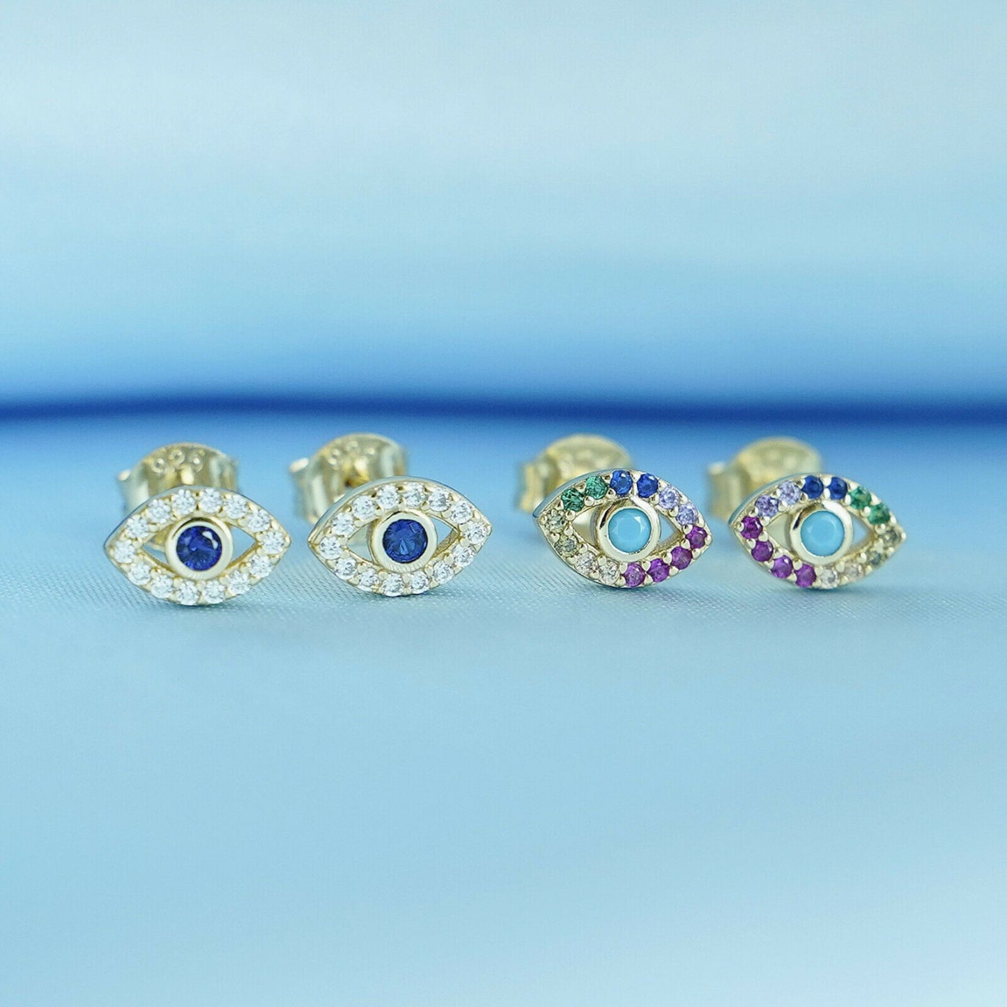 Sterling Silver Evil Eye Stud Earrings with 14K Gold Plating and Blue and White CZ