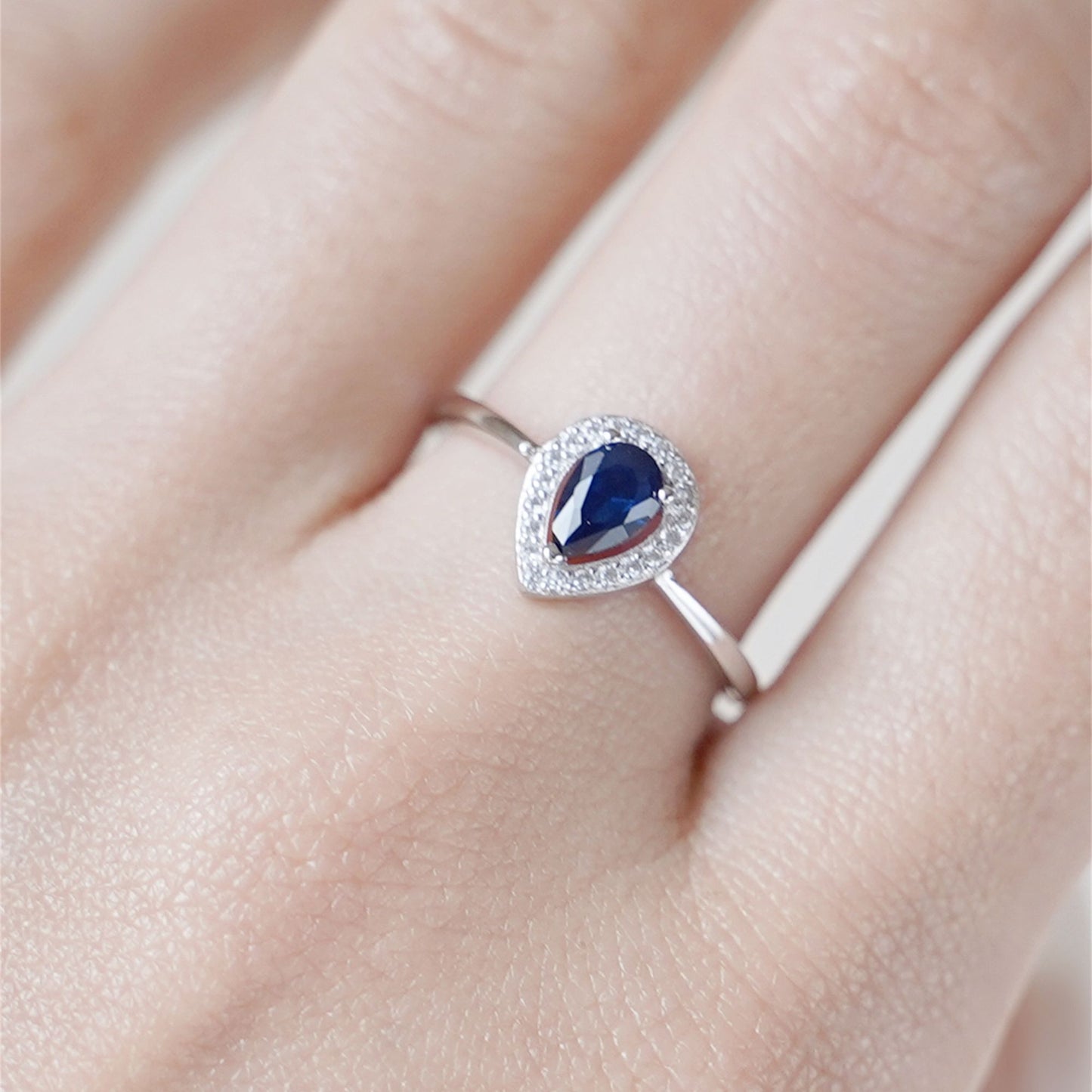 Rhodium on Sterling Silver Teardrop Cut Blue Sapphire Paved CZ Halo Sizable Ring - sugarkittenlondon