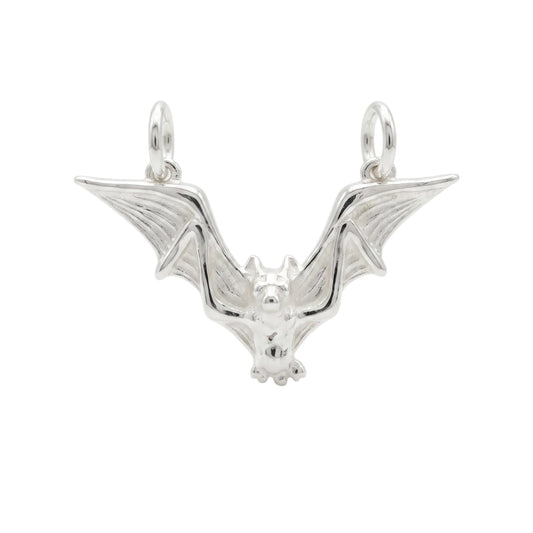 Flying bat gothic charm with raised wings and small face detail, silver-toned
