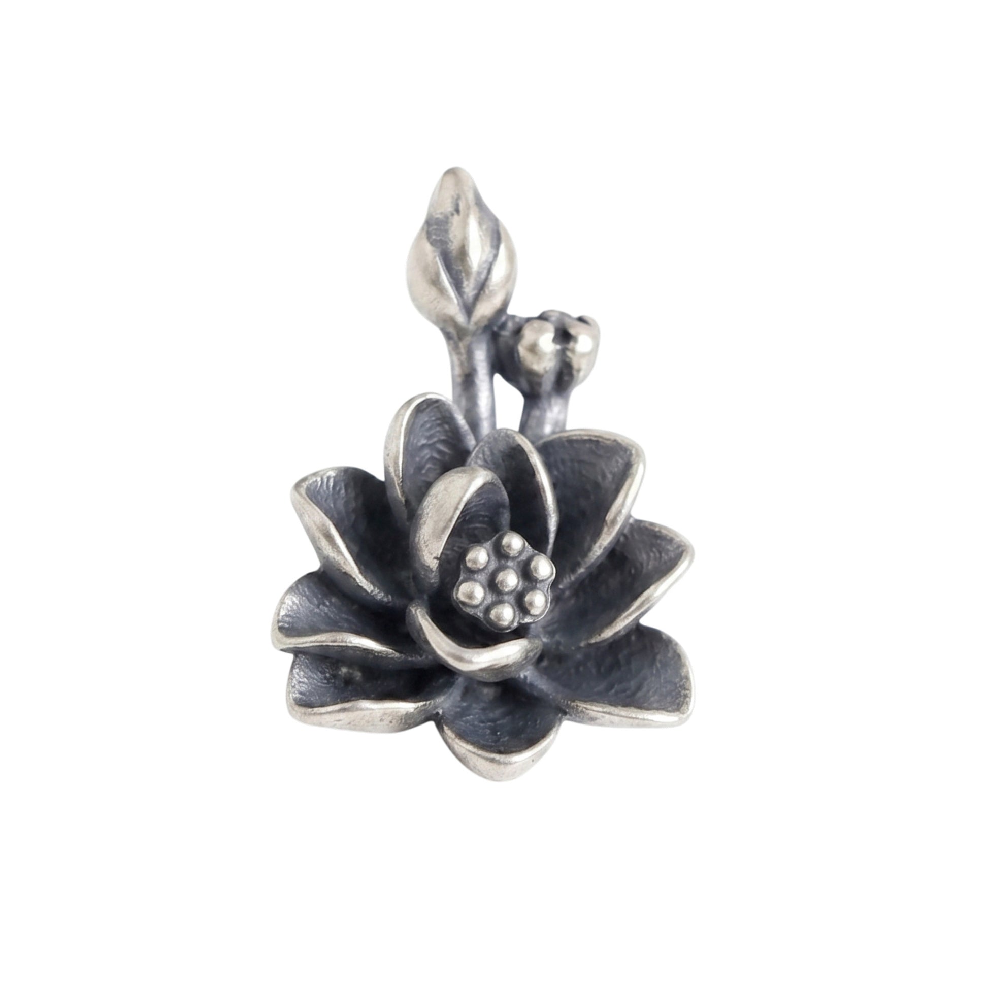 Oxidized lotus flower charm with textured petals and small bead details