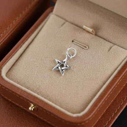 Hollow Lucky Star Charm: star pendant with loop bail, angled view