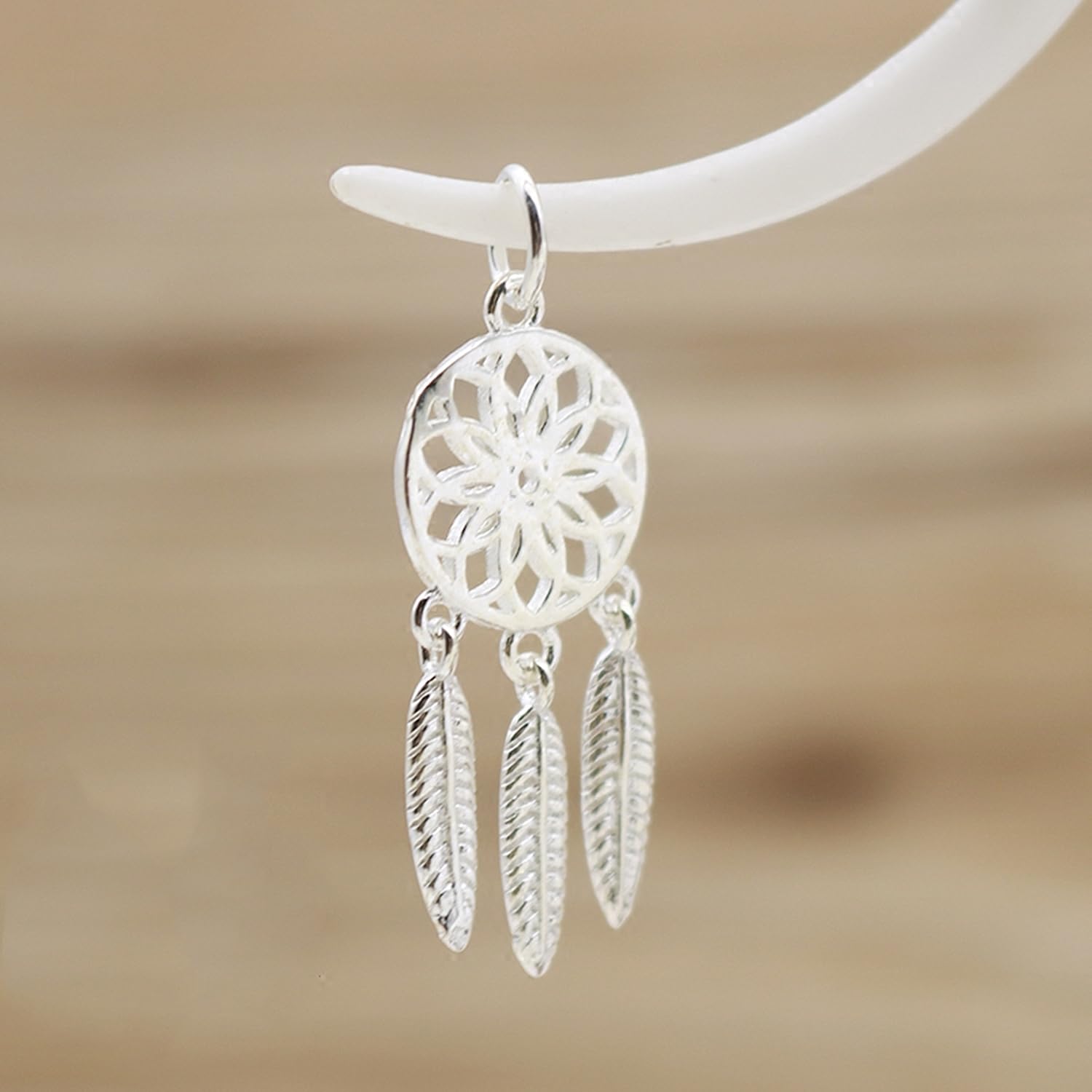 Dream Catcher Charm: silver-tone round filigree medallion and three hanging feather charms