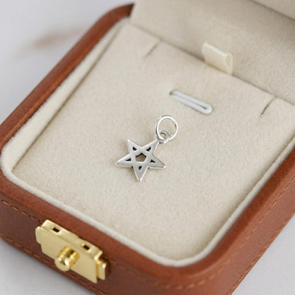 Hollow Lucky Star Charm: star pendant with crisscross cutout and loop bail