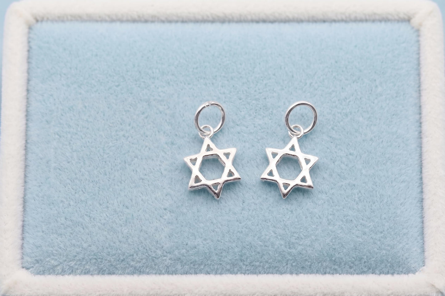 Two Star of David hollow charm pendants on loops, silver-tone
