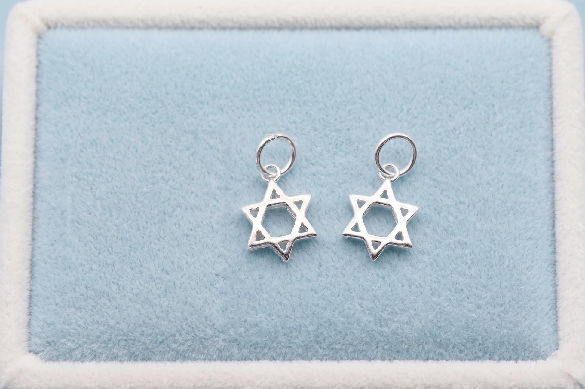 Two Star of David hollow charm pendants on loops, silver-tone