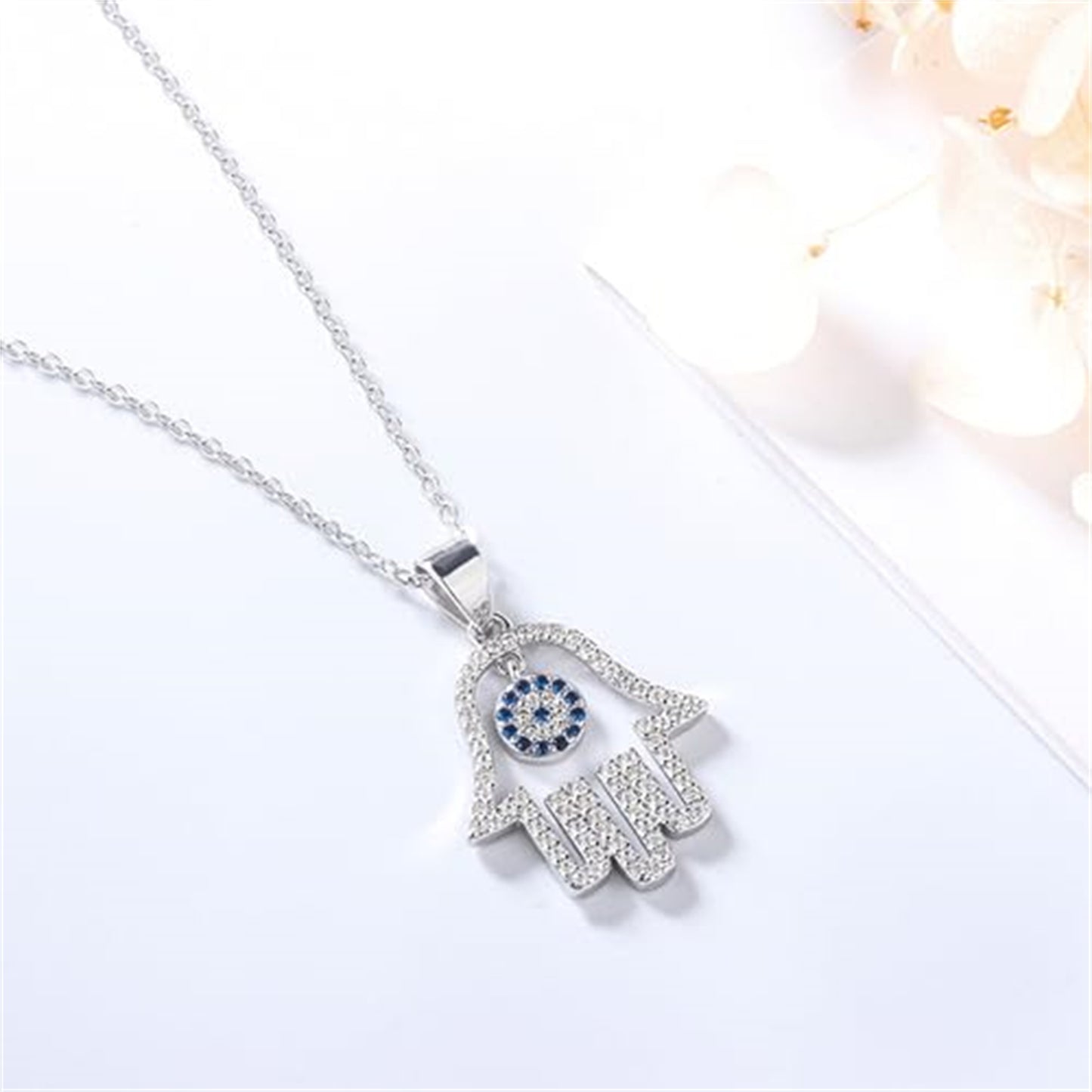 Sterling Silver Hollow Blue Paved CZ Evil Eye Hamsa Hand of Fatima Pendant