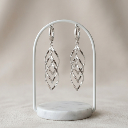 Pair of silver-tone long dangling hoop earrings with geometric lattice drops