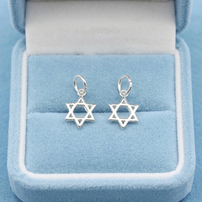 Two Star of David hollow charms with small loops, silver-tone