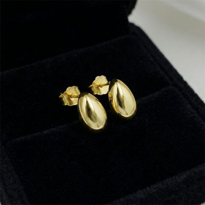 14K gold teardrop stud earrings with shiny oval drop faces