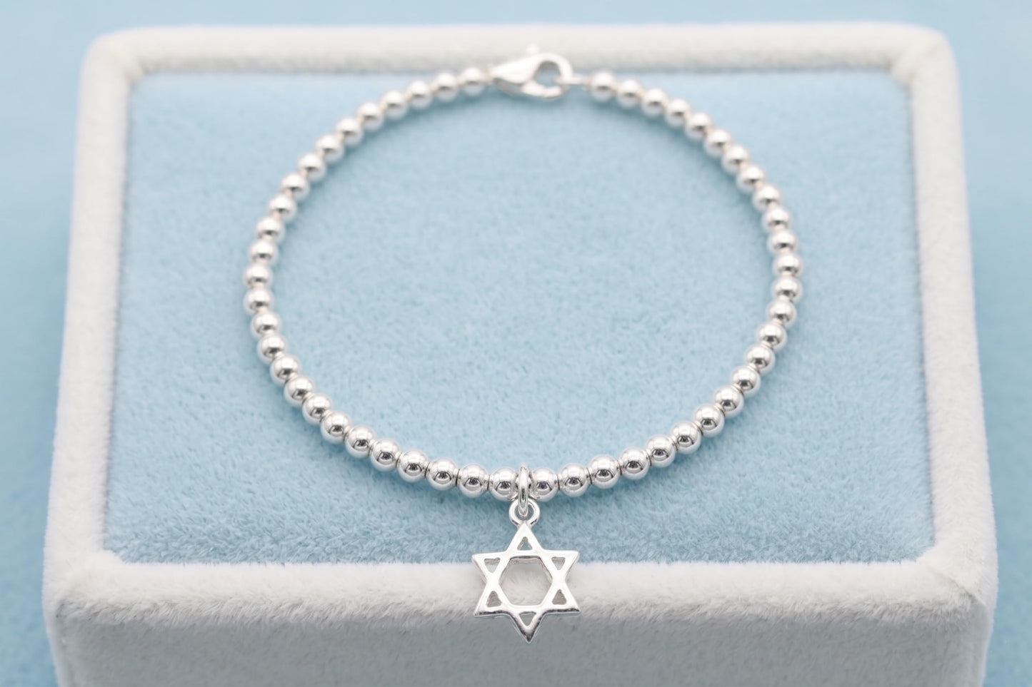 Beaded bracelet with Star of David hollow charm pendant, silver-tone