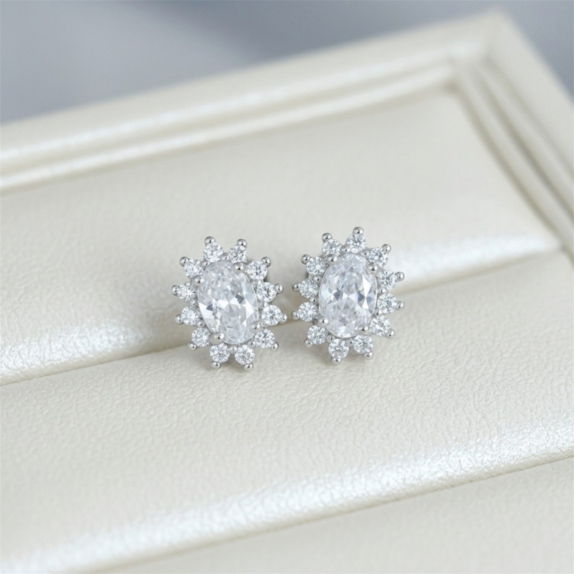 Clear round gemstone cluster earrings with silver-tone prong setting