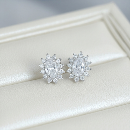 Clear round gemstone cluster earrings with silver-tone prong setting