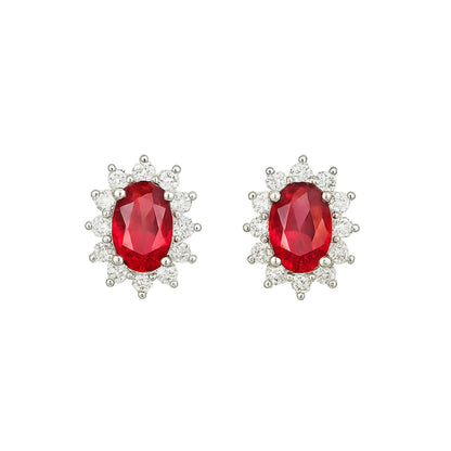 Oval red garnet cluster stud earrings with crystal halo, silver-tone setting