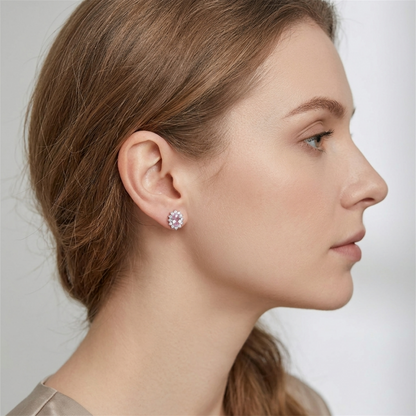 Pink oval gemstone cluster earrings worn on ear