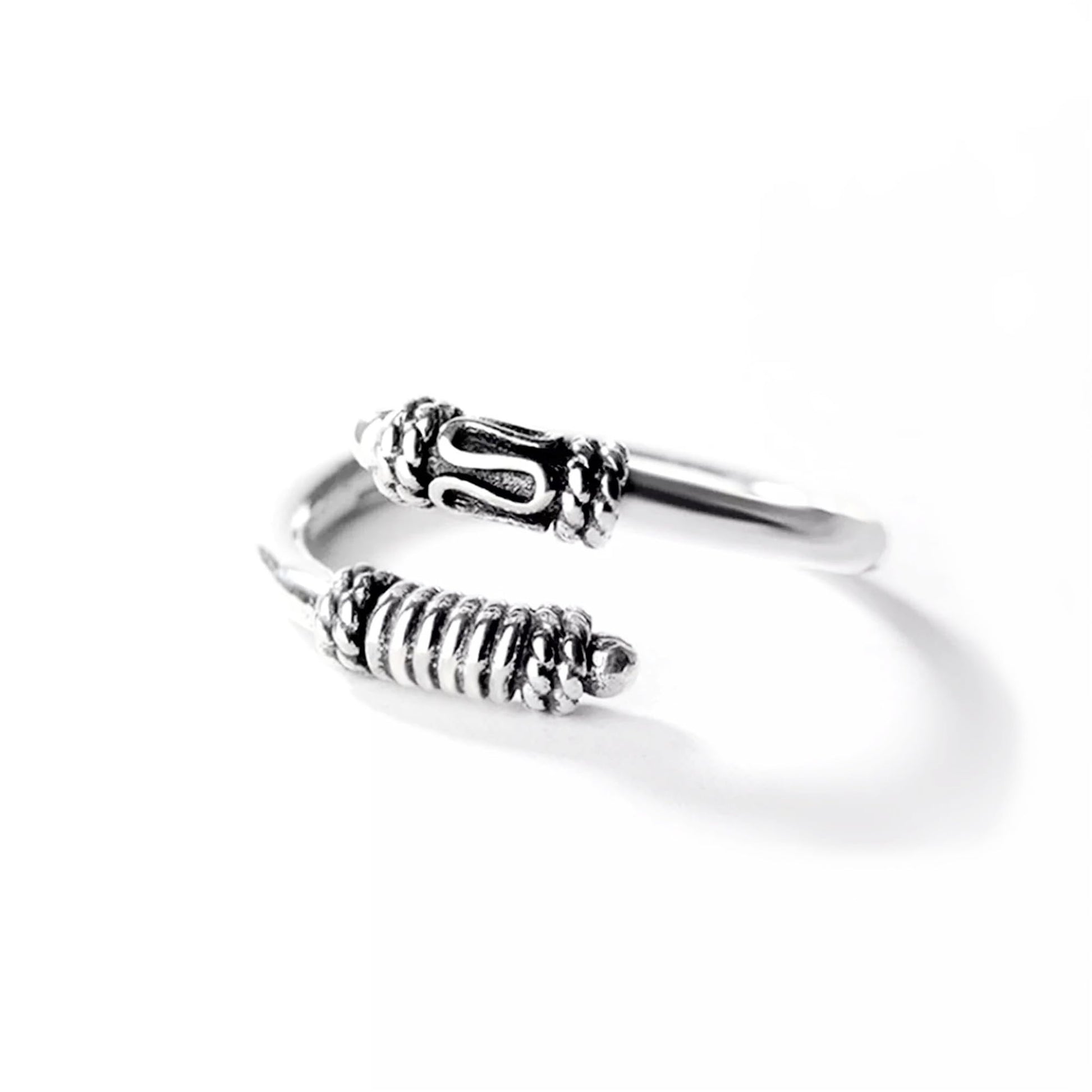 Oxidized silver totem knot ring with ridged band and raised knot detail