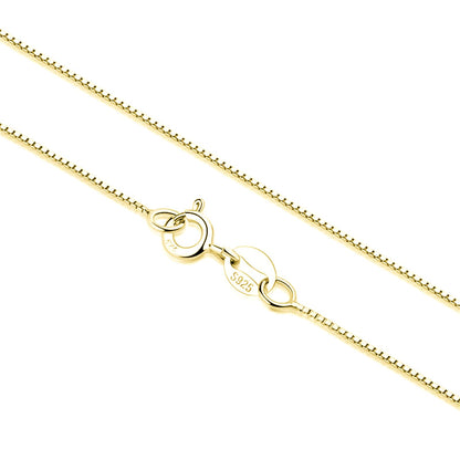 Box chain necklace with teardrop ring and clasp charms, gold-tone finish