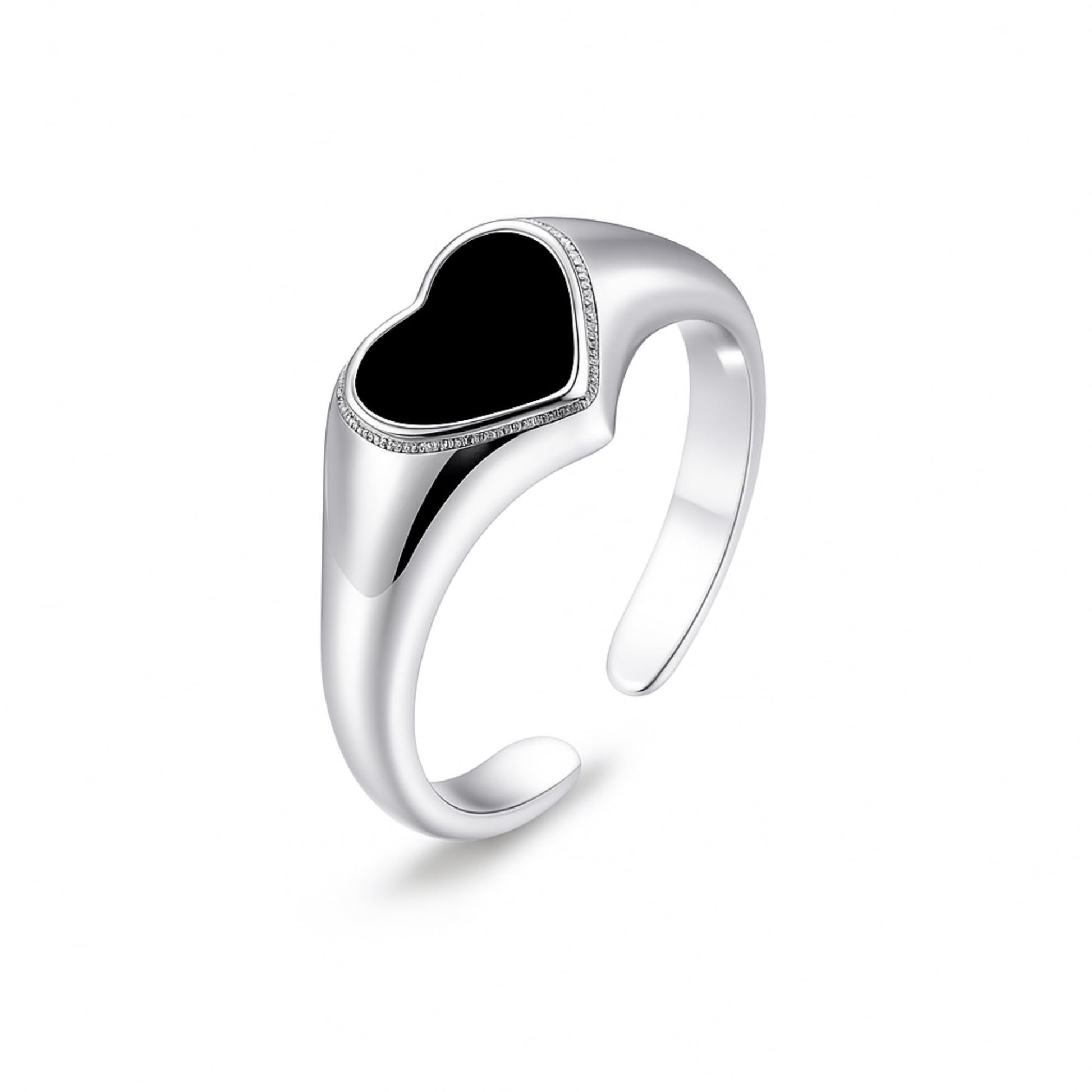 Silver heart ring with raised black center and textured band detail