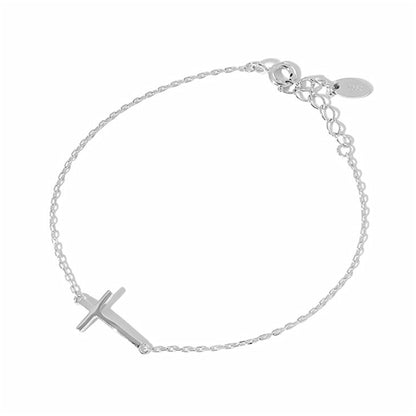 Silver-tone cross anklet bracelet with sideways cross charm, full length.