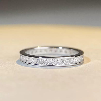 Silver eternity ring with pavé round stones across the top, low profile view