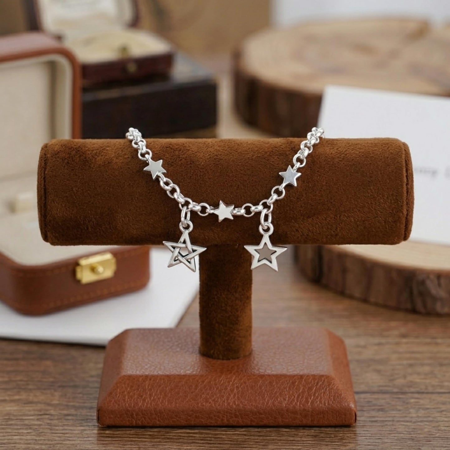 Star charm bracelet/chain with multiple star pendants and small ring links