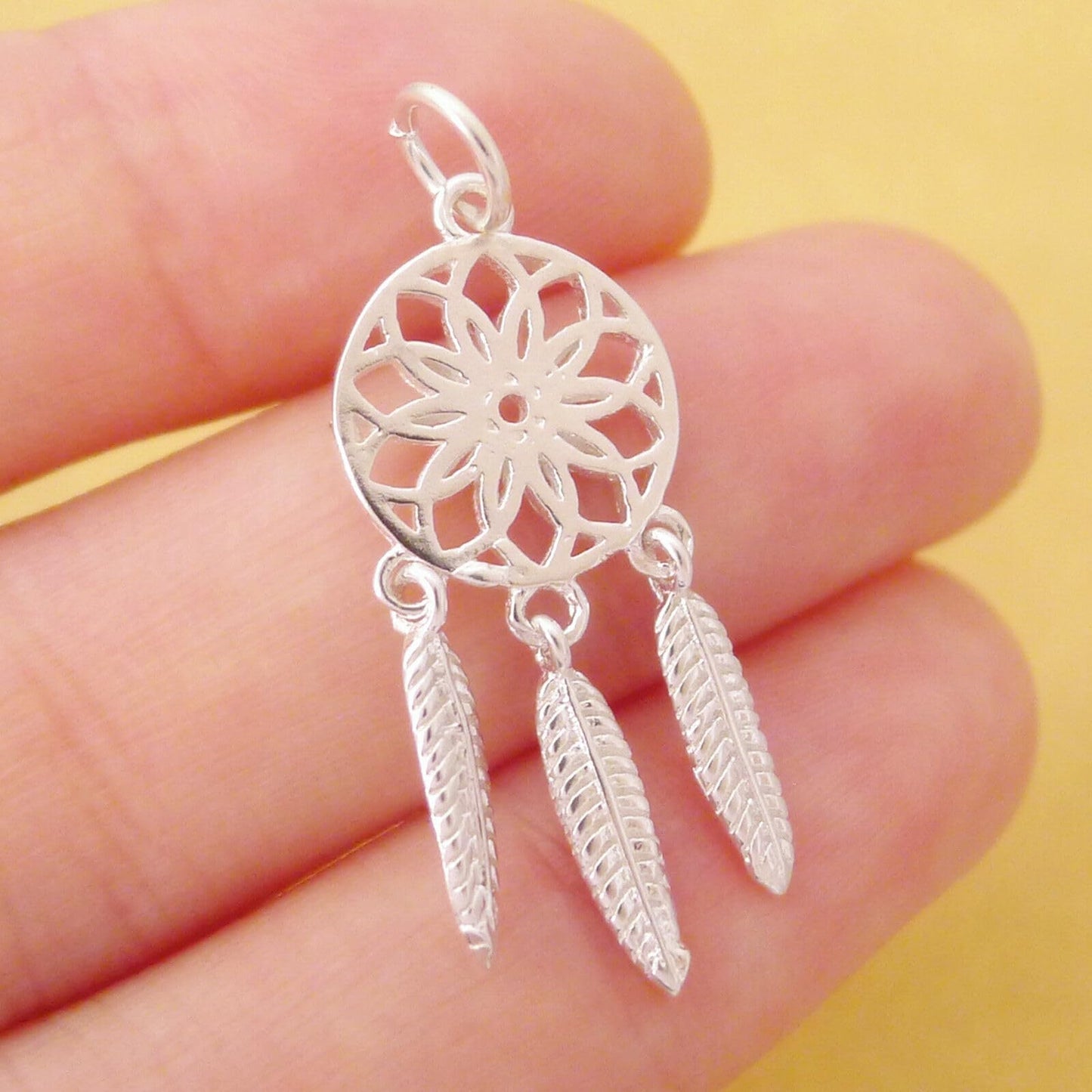 Dream Catcher Charm with red center detail, silver-tone round filigree and three feathers