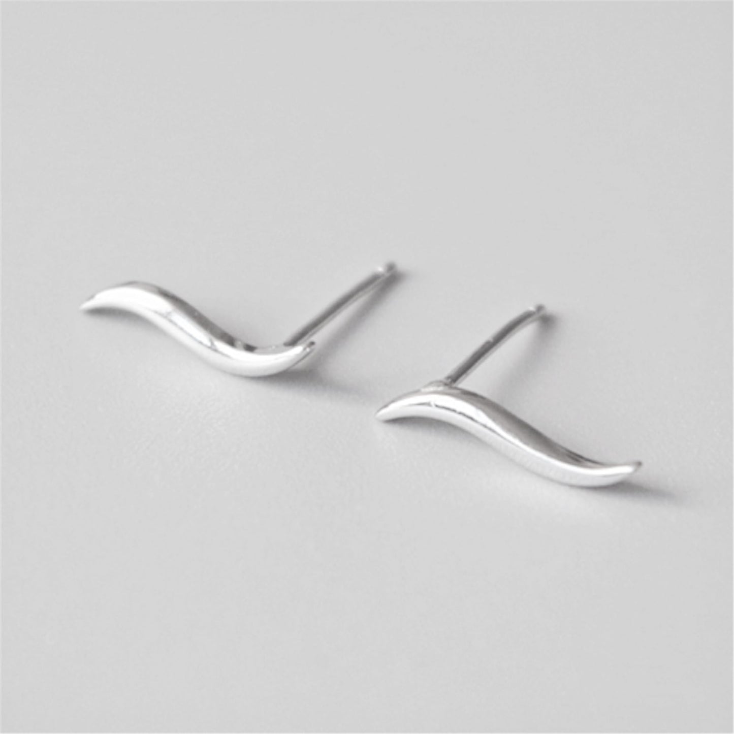 Silver wavy vine climber stud earrings with pointed post backs