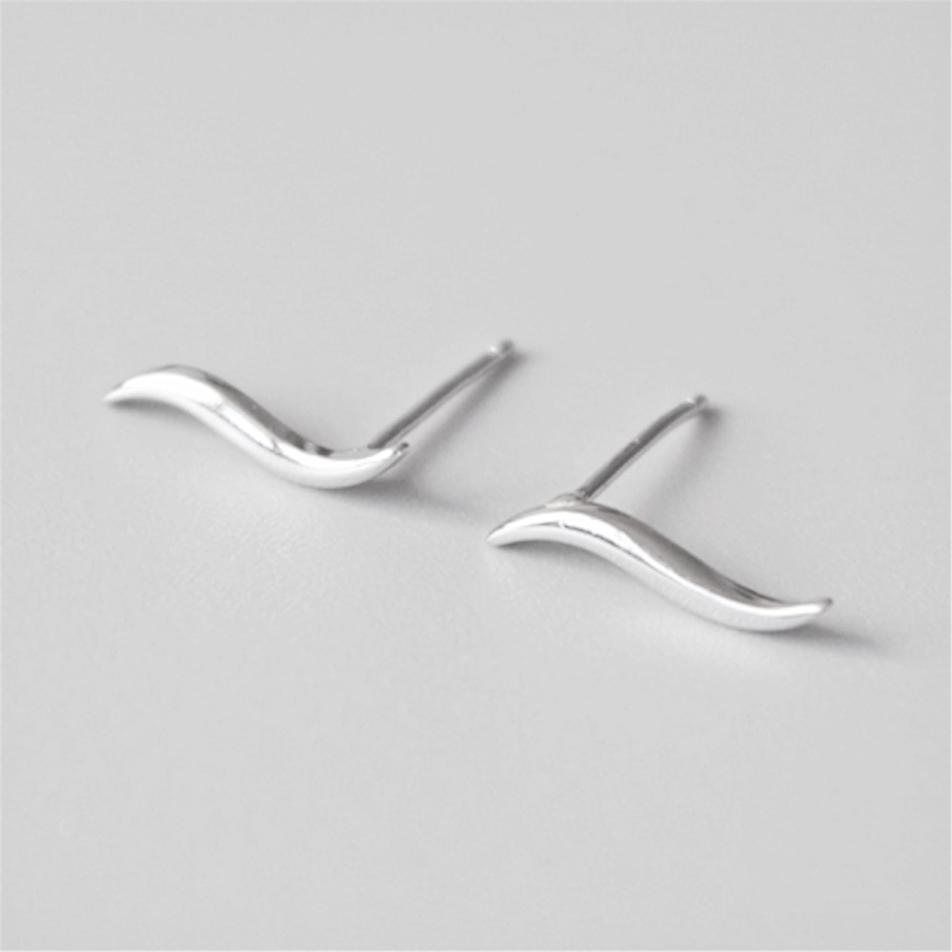 Silver wavy vine climber stud earrings with pointed post backs