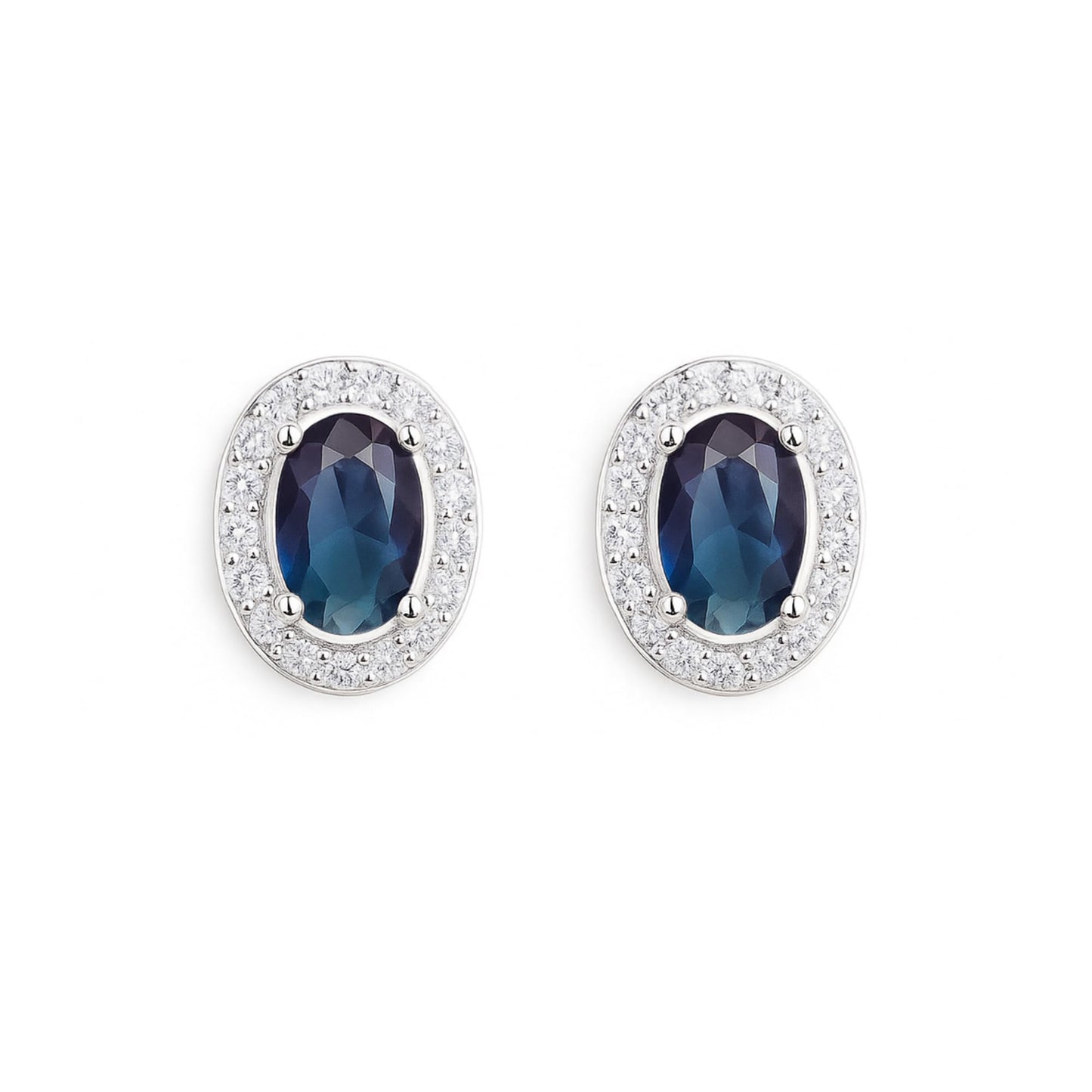 Oval halo CZ stud earrings with dark blue oval stones and silver pavé halo
