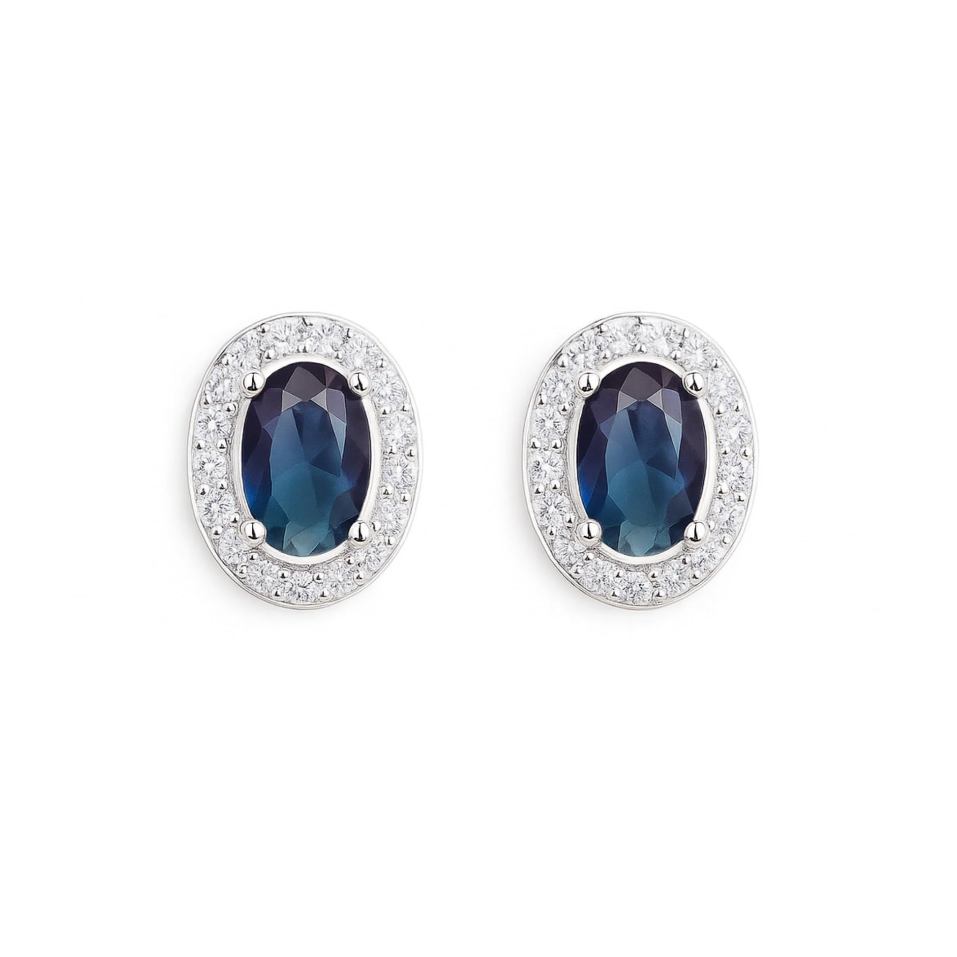 Oval halo CZ stud earrings with dark blue oval stones and silver pavé halo