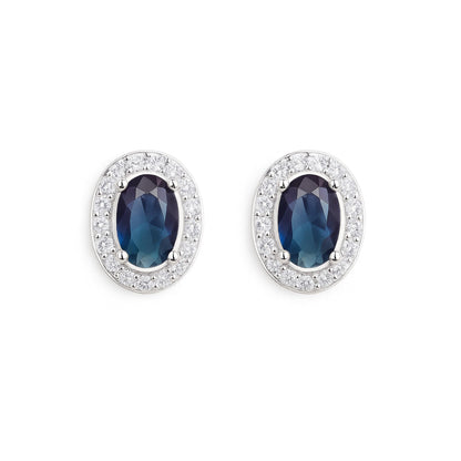 Oval halo CZ stud earrings with dark blue oval stones and silver pavé halo