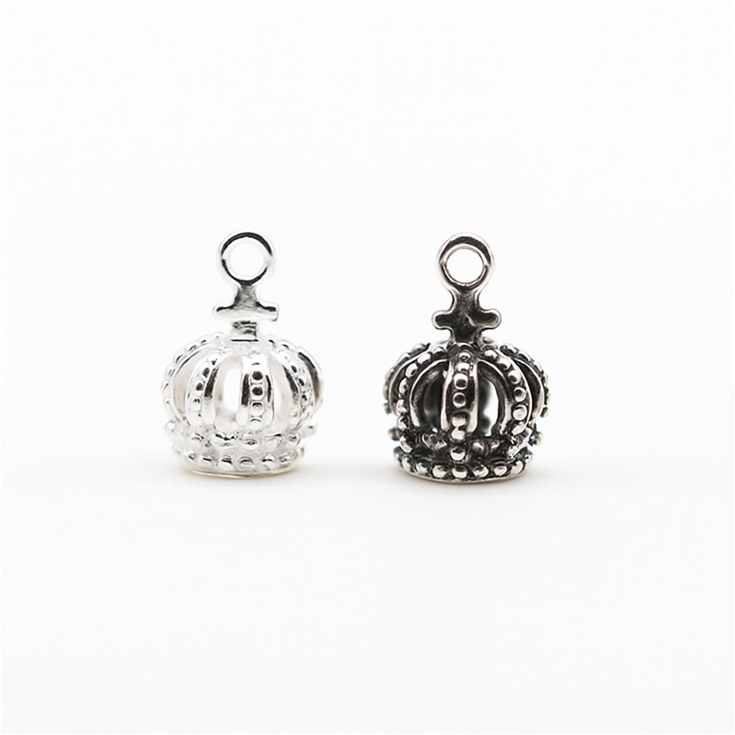 Crown charm pair with ring top, silver-tone filigree crown design
