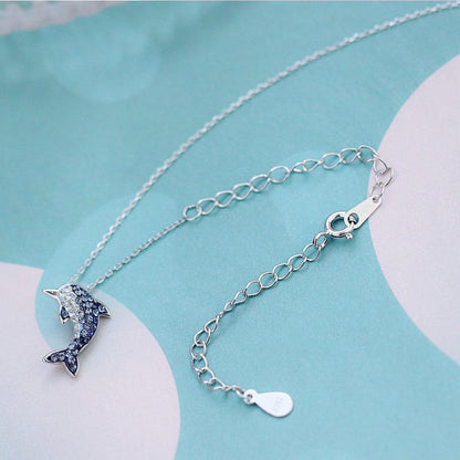 Silver curb extender chains with oval links, small charm, and teardrop 925-marked tag