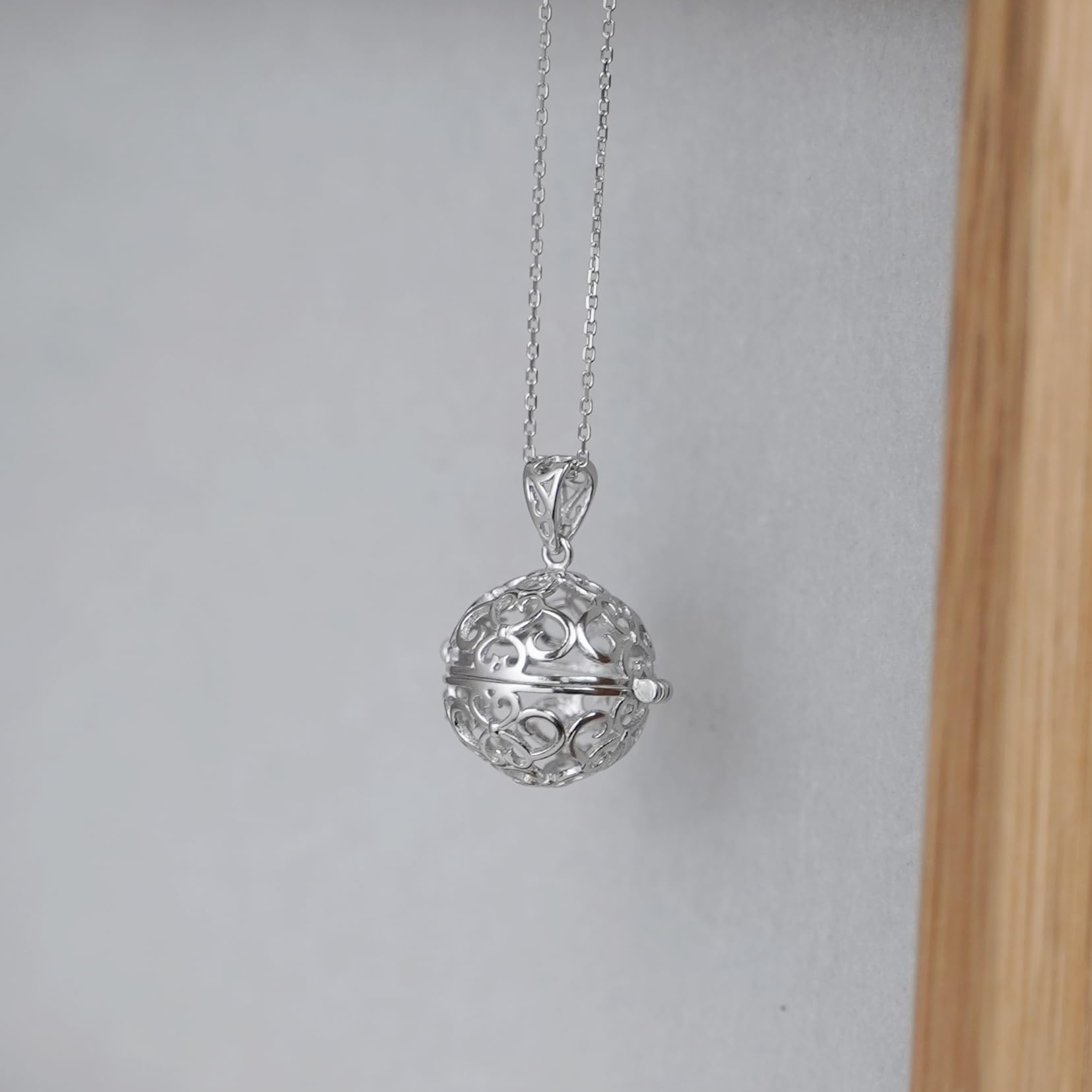 Rhodium curb belcher chain necklace with filigree ball pendant, silver tone.