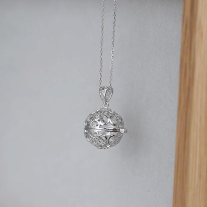 Rhodium curb belcher chain necklace with filigree ball pendant, silver tone.