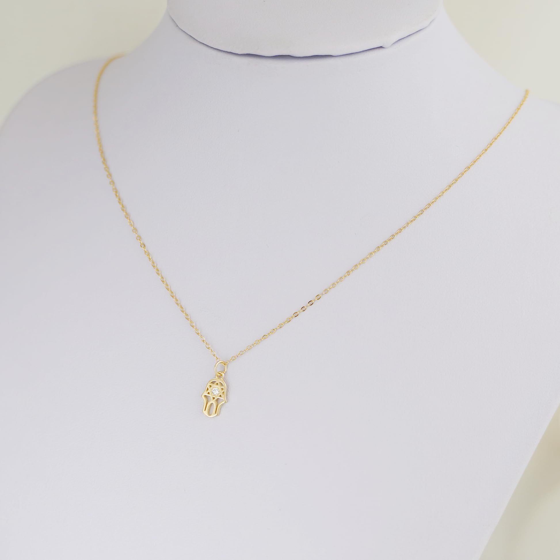 Gold-tone link chain necklace with hamsa hand charm
