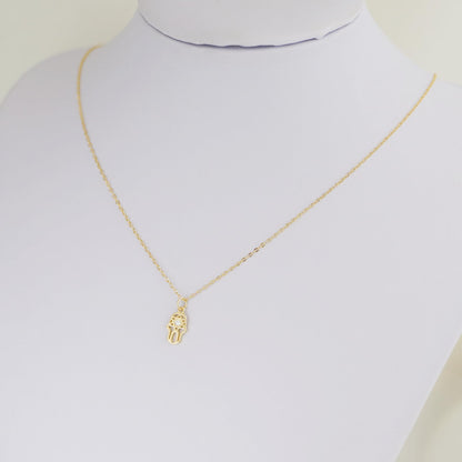 Gold-tone link chain necklace with hamsa hand charm