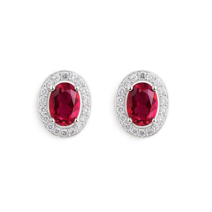 Oval halo CZ stud earrings with ruby-red oval stones and silver pavé halo