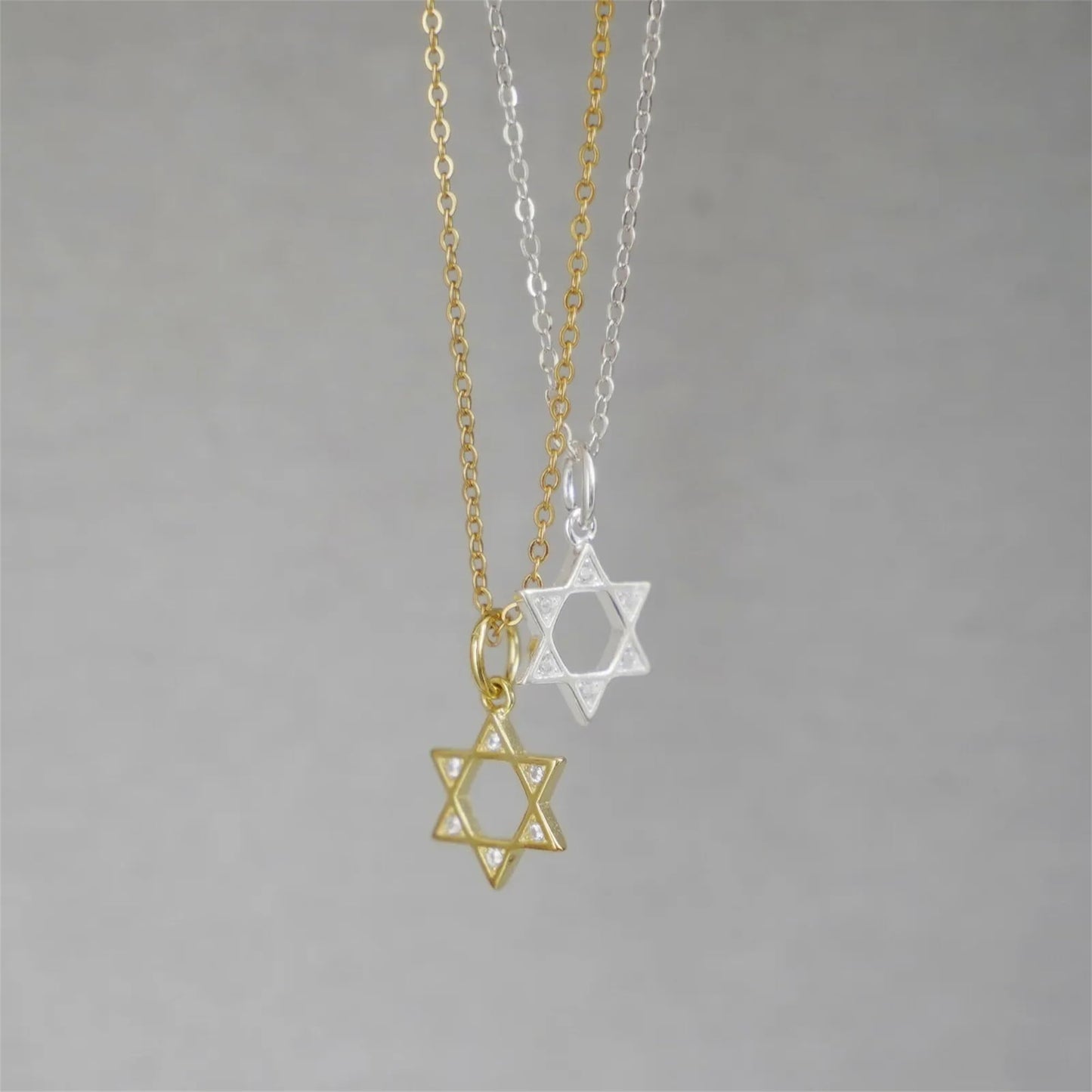 Star of David necklace set with gold and silver pendants