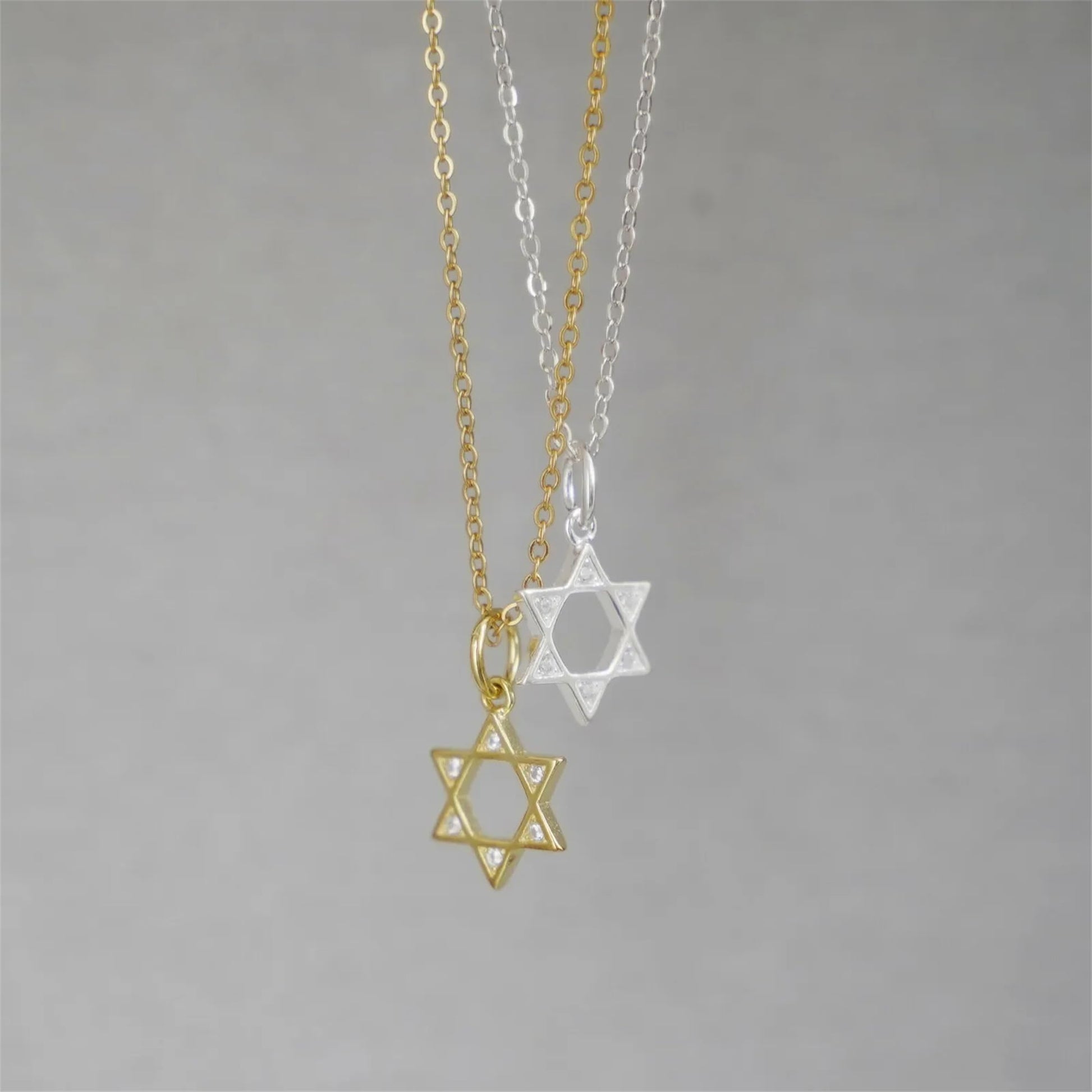 Star of David necklace set with gold and silver pendants