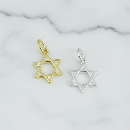 Star of David pendant charms in gold and silver tones with clear-stone detail