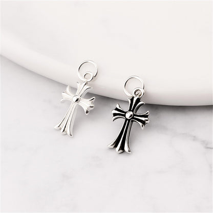 Two-tone fleur-de-lis cross charms on loop hooks, plain silver and oxidised silver