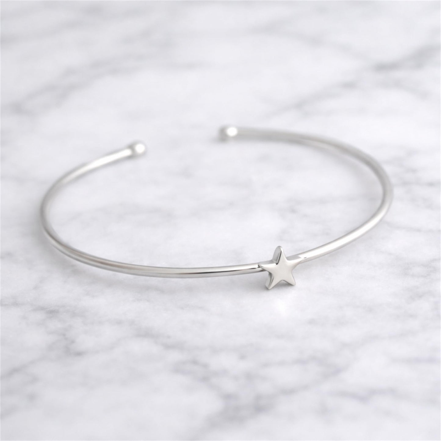 Silver star charm torque bangle bracelet with open cuff and star detail